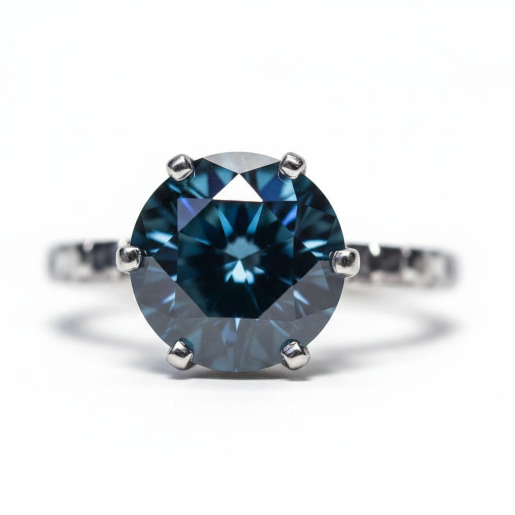 2 carat dark blue round moissanite solitaire ring in platinum plated 925 sterling silver on a white background