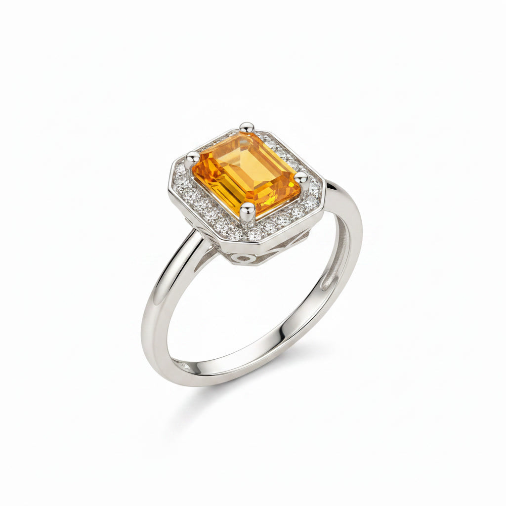 Natural emerald cut citrine gemstone halo ring shown at 45 degree angle