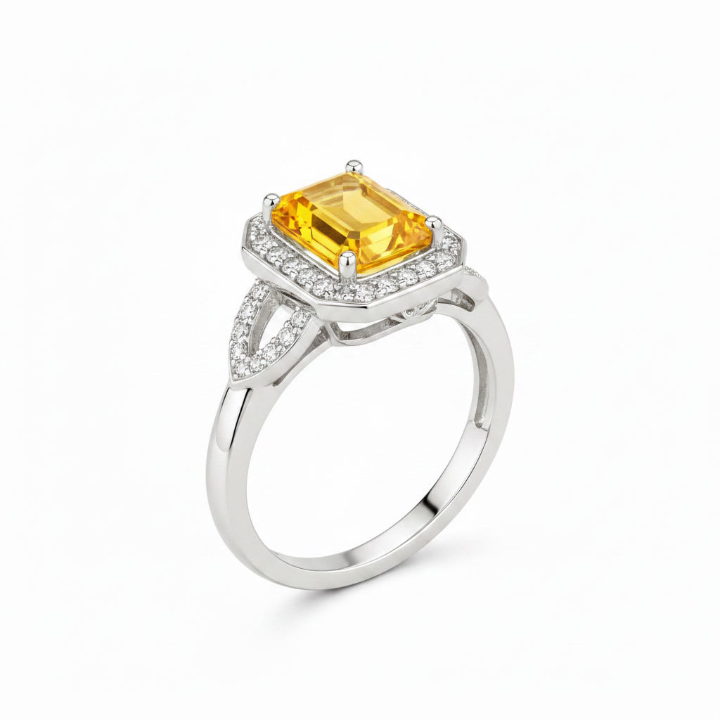 Natural emerald cut citrine halo ring shown at 45 degree angle
