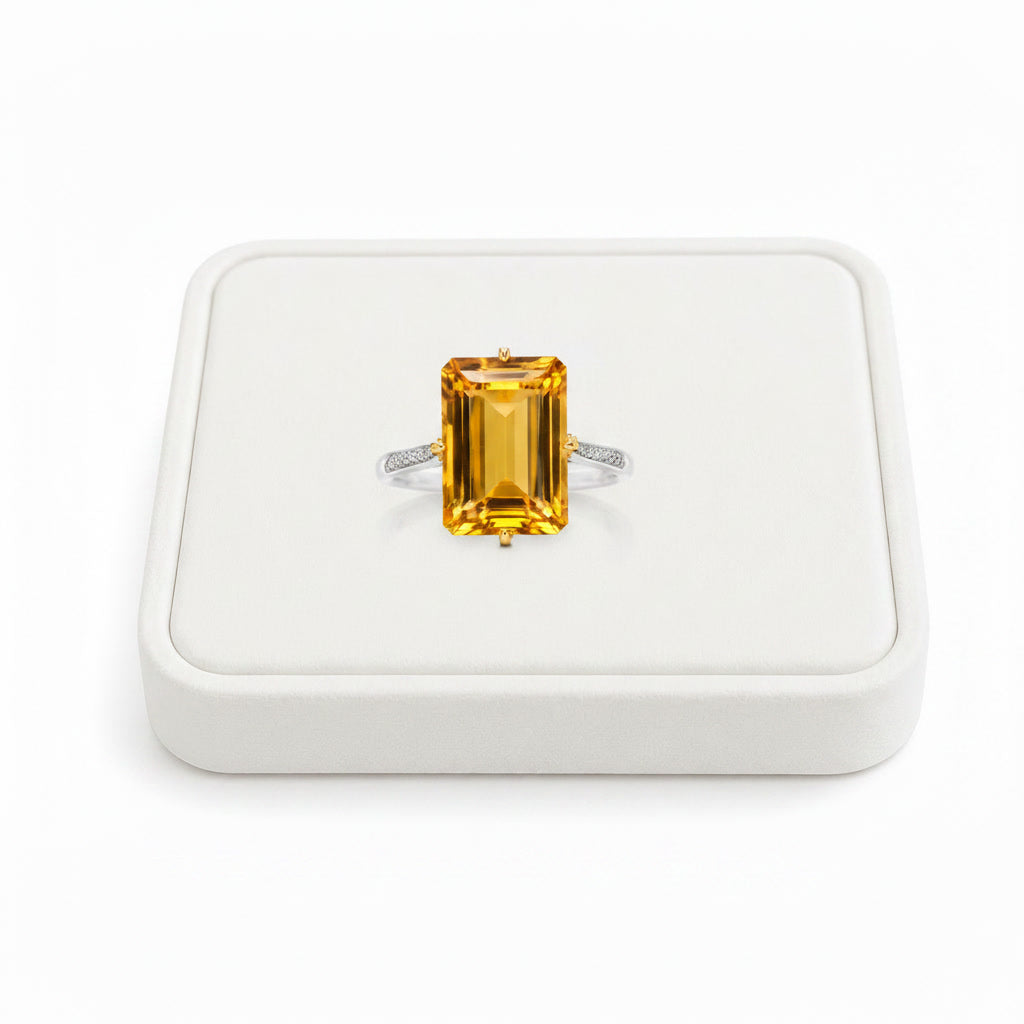 Natural 10x14mm emerald cut citrine statement ring displayed on white velvet jewelry tray