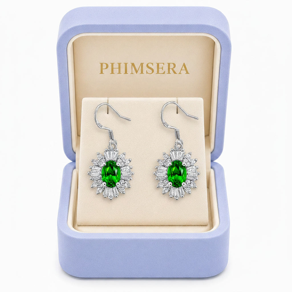 Natural 4x6mm oval chrome diopside halo drop earrings crafted in 925 sterling silver with vivid green gemstones and sparkling cubic zirconia accents.