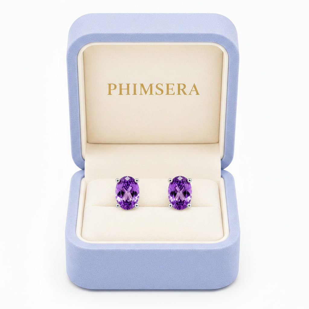 Natural 4x6mm oval amethyst stud earrings in 925 sterling silver with platinum plated finish in Phimsera box