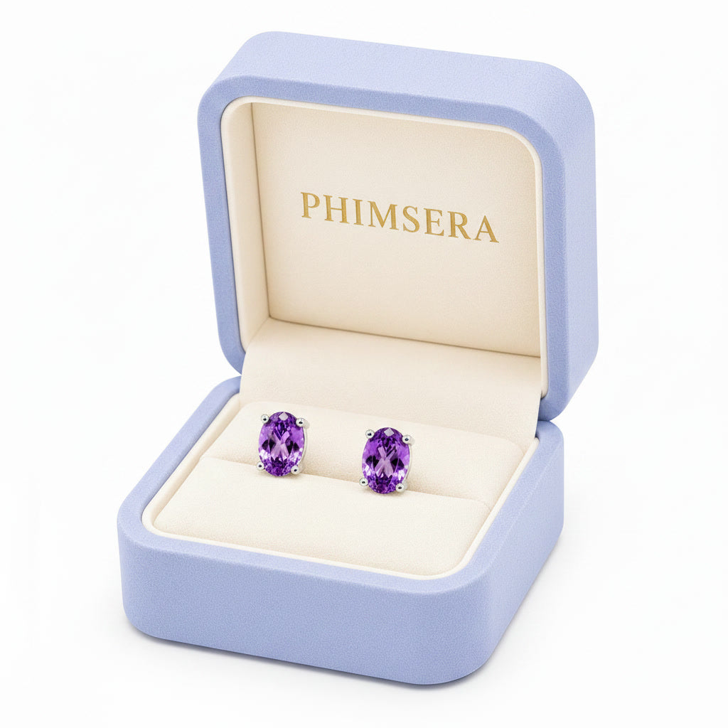 Natural 4x6mm oval amethyst stud earrings in 925 sterling silver with platinum plated finish in Phimsera box
