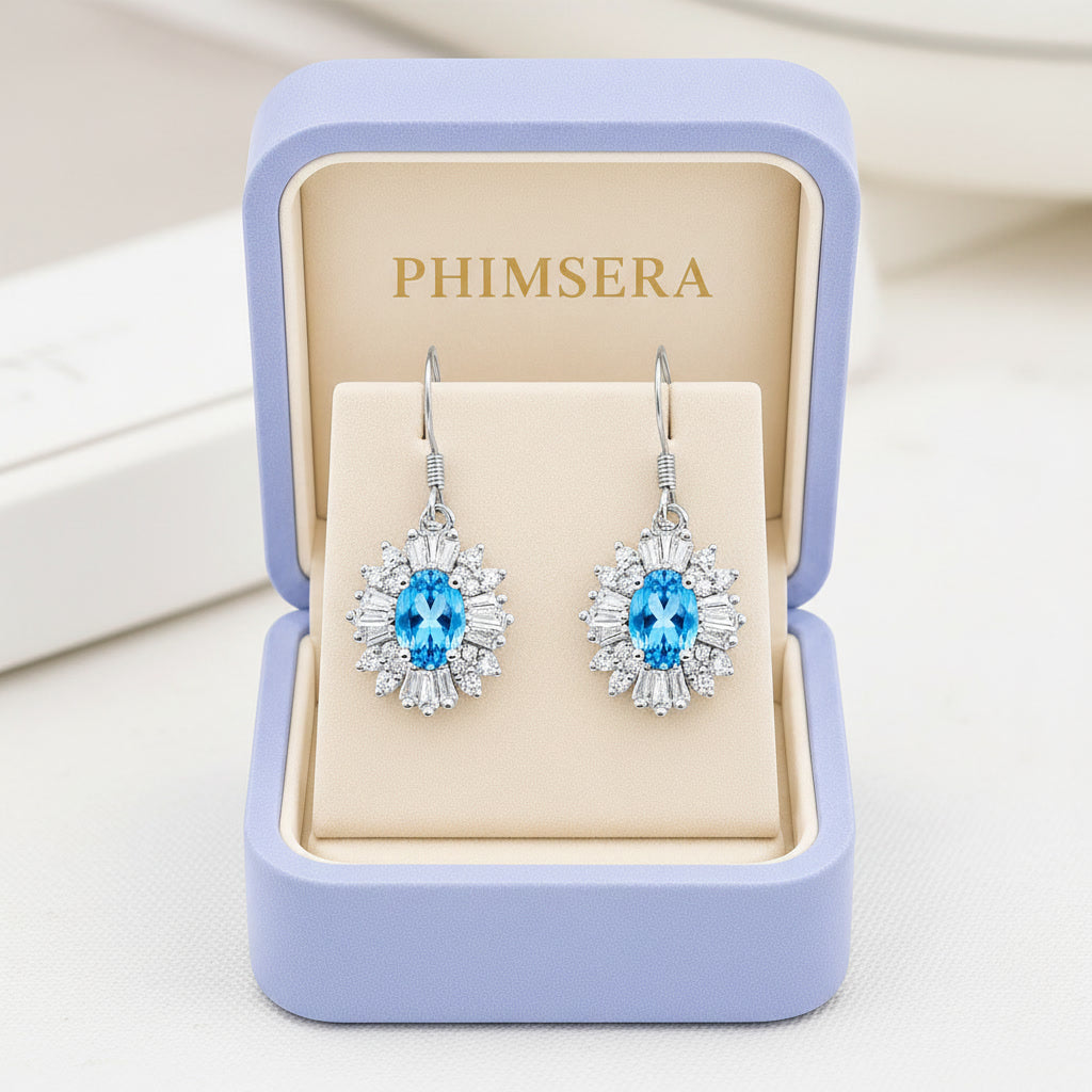 Natural 4x6mm Oval Swiss Blue Topaz Floral Halo Dangle Earrings in 925 Sterling Silver | Platinum Plated