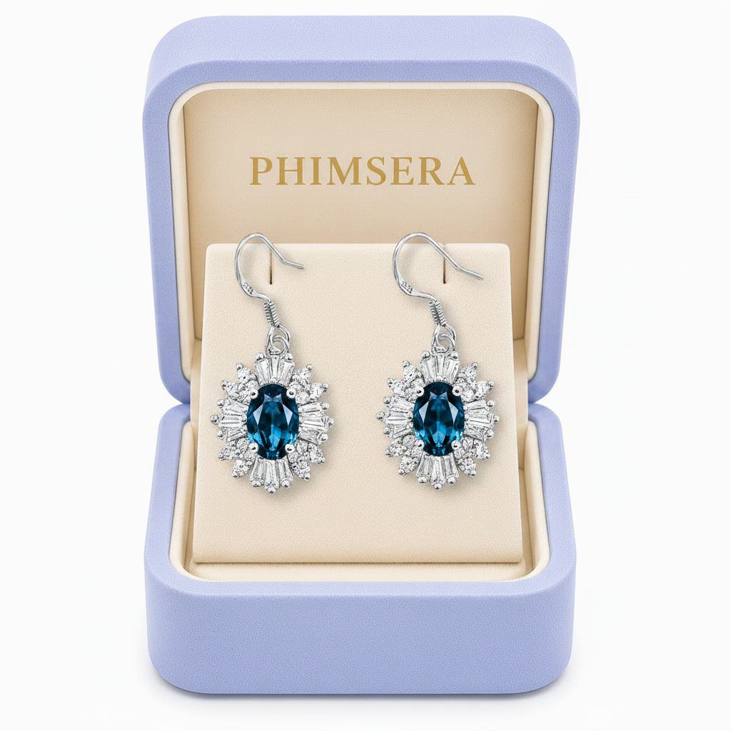 Natural 4x6mm London Blue Topaz floral halo dangle earrings in Platinum Plated 925 sterling silver with cubic zirconia accents in Phimsera box