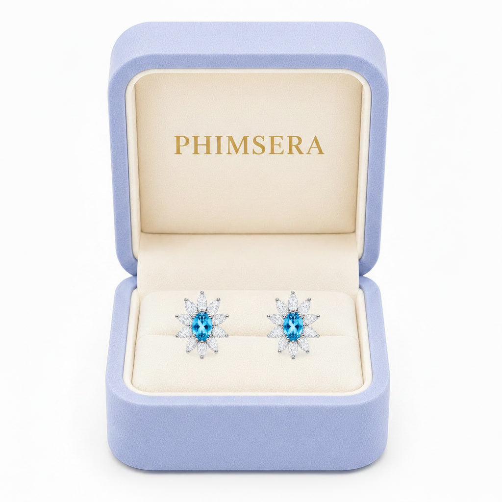 Natural 4x6mm Swiss Blue Topaz floral halo stud earrings in 925 sterling silver with marquise cubic zirconia accents
