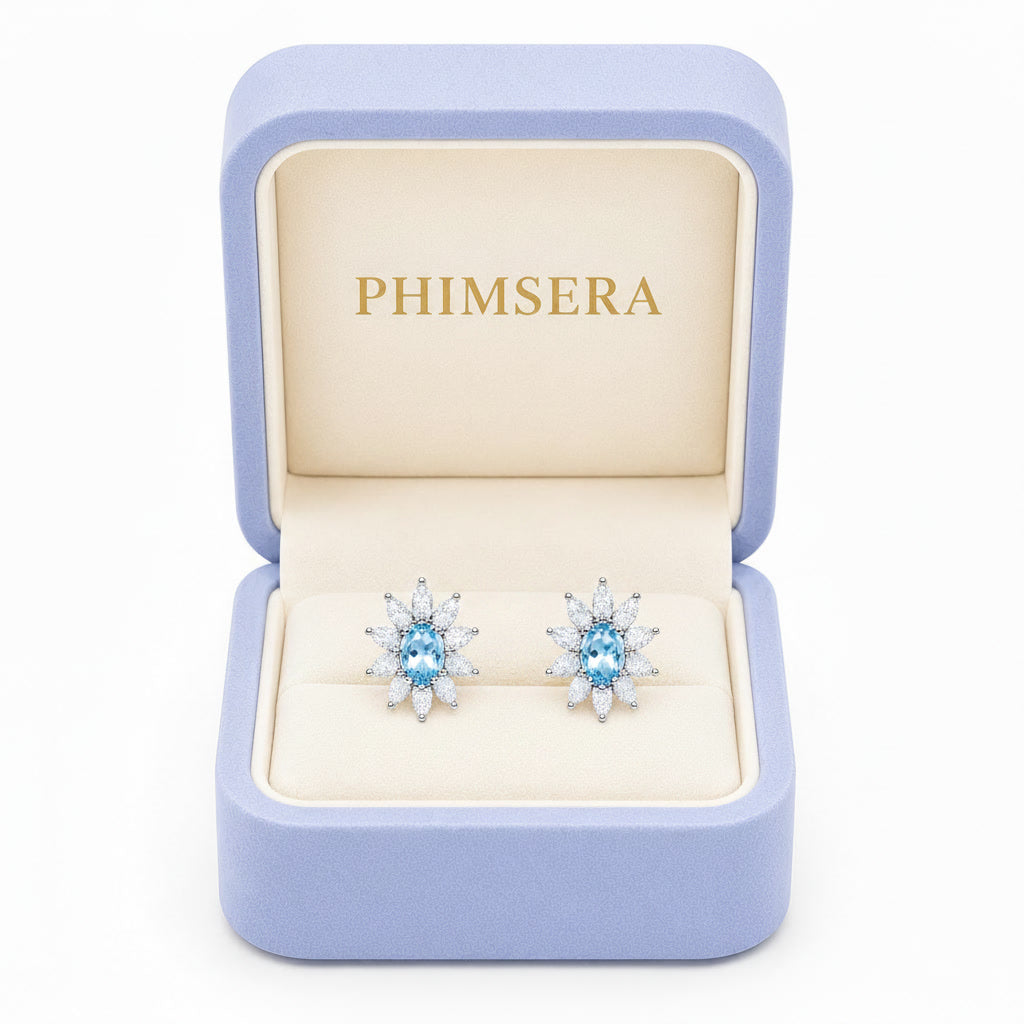 Natural 4x6mm Sky Blue Topaz floral halo stud earrings in 925 sterling silver with marquise cubic zirconia and platinum plated finish