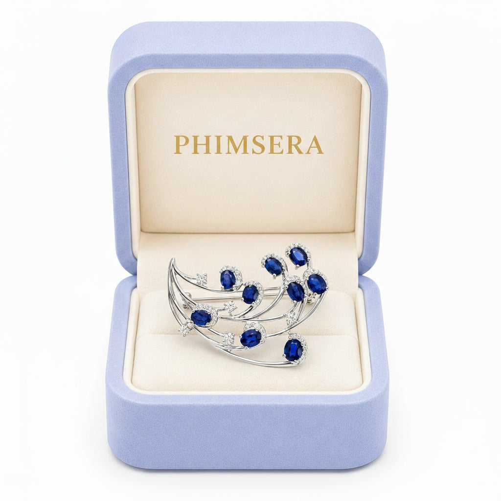 Natural Blue Sri Lanka Sapphire Brooch Pin in 925 Sterling Silver featuring nine 4x5 mm oval natural sapphires with cubic zirconia accents