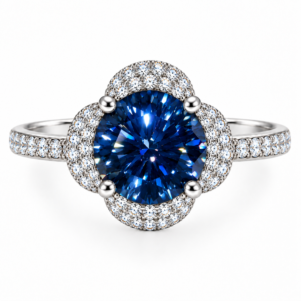 Top-down view of an 8mm deep blue moissanite ring showing its round brilliant gemstone, symmetrical four-petal floral halo, four polished prongs and clear cubic zirconia band accents.