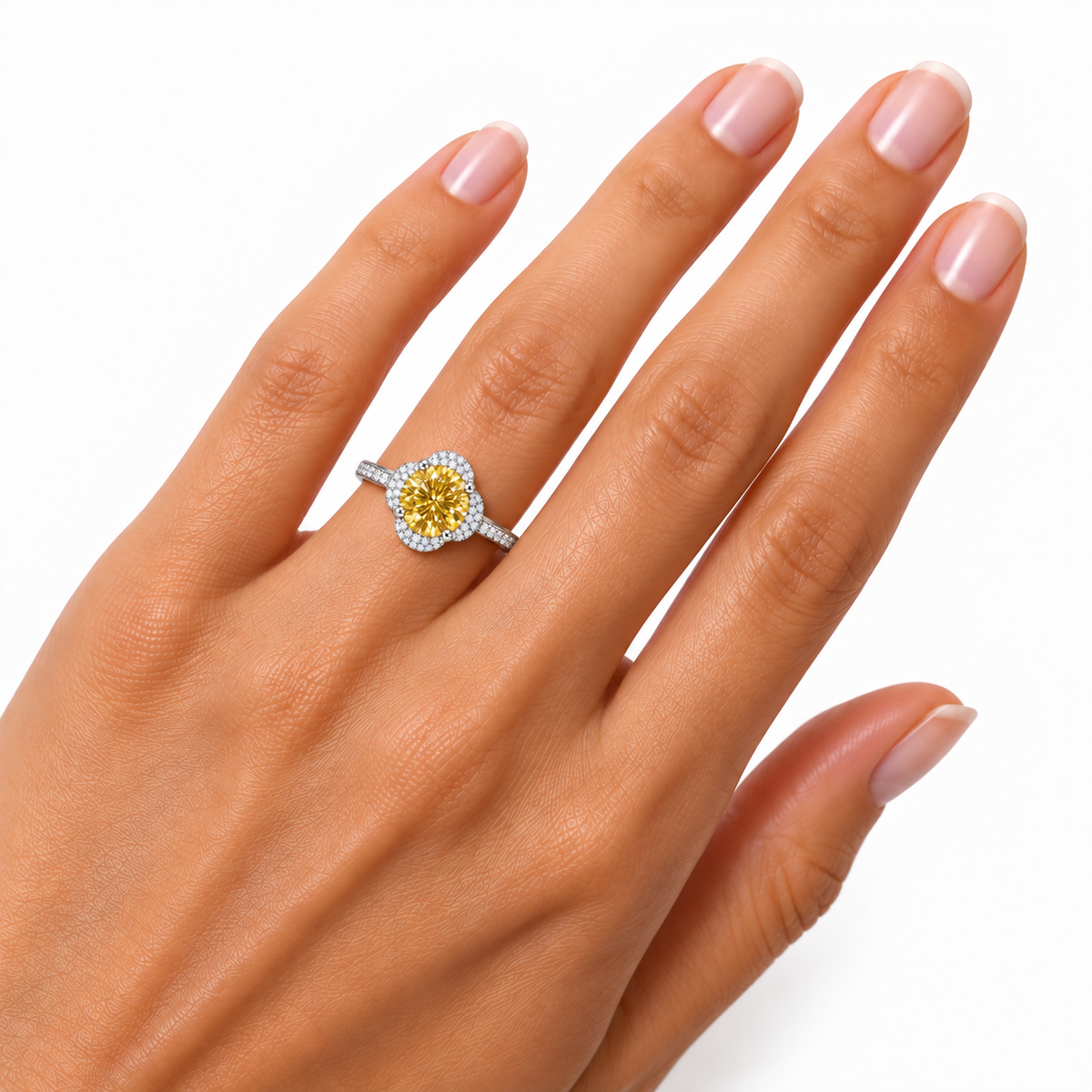 Phimsera 2 carat yellow moissanite floral halo ring worn on a woman's ring finger, showcasing the 8mm round brilliant golden-yellow gemstone and cubic zirconia floral setting.