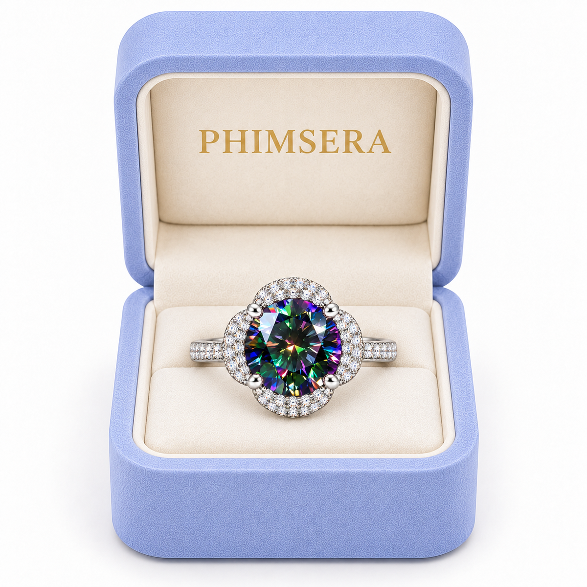 Black rainbow moissanite floral halo ring displayed inside a periwinkle Phimsera jewelry gift box with ivory velvet interior and gold PHIMSERA lettering, featuring a vibrant multicolored gemstone and sparkling sterling silver setting.