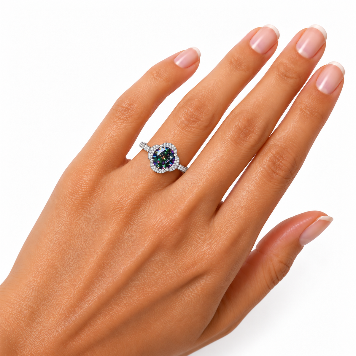 halo ring worn on the ring finger, showing realistic gemstone proportions, brilliant green and purple reflections and an elegant pavé-accented silver band.