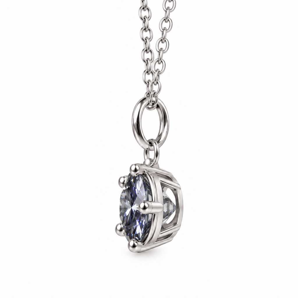 Side profile of a 2 carat gray moissanite pendant necklace showing the depth of the 8mm round brilliant gemstone, open silver basket setting, polished prongs, and oval pendant bail against a pure white background.