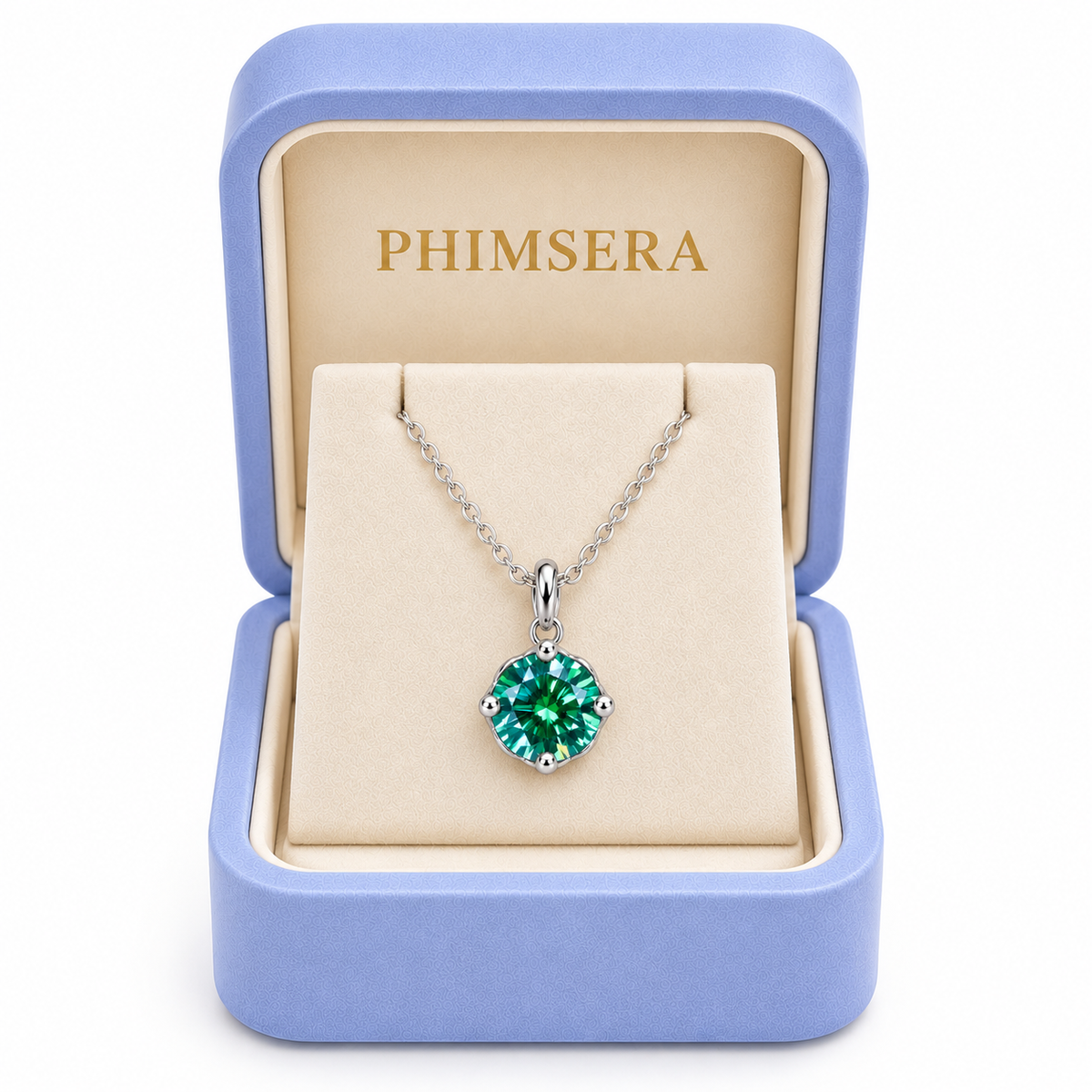 2 carat emerald green moissanite solitaire necklace displayed inside an open periwinkle Phimsera jewelry gift box with an ivory interior, gold Phimsera logo, and white studio background.