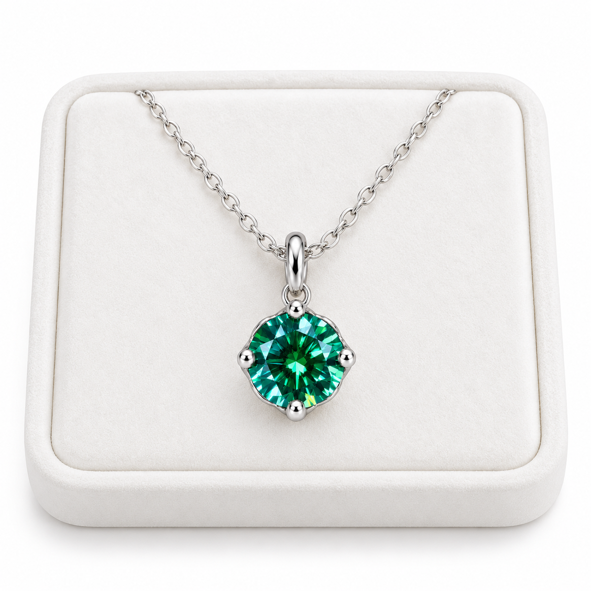 2 carat emerald green moissanite solitaire necklace arranged on a premium white velvet jewelry tray with a delicate sterling silver chain and brilliant 8mm round green gemstone against a pure white background.