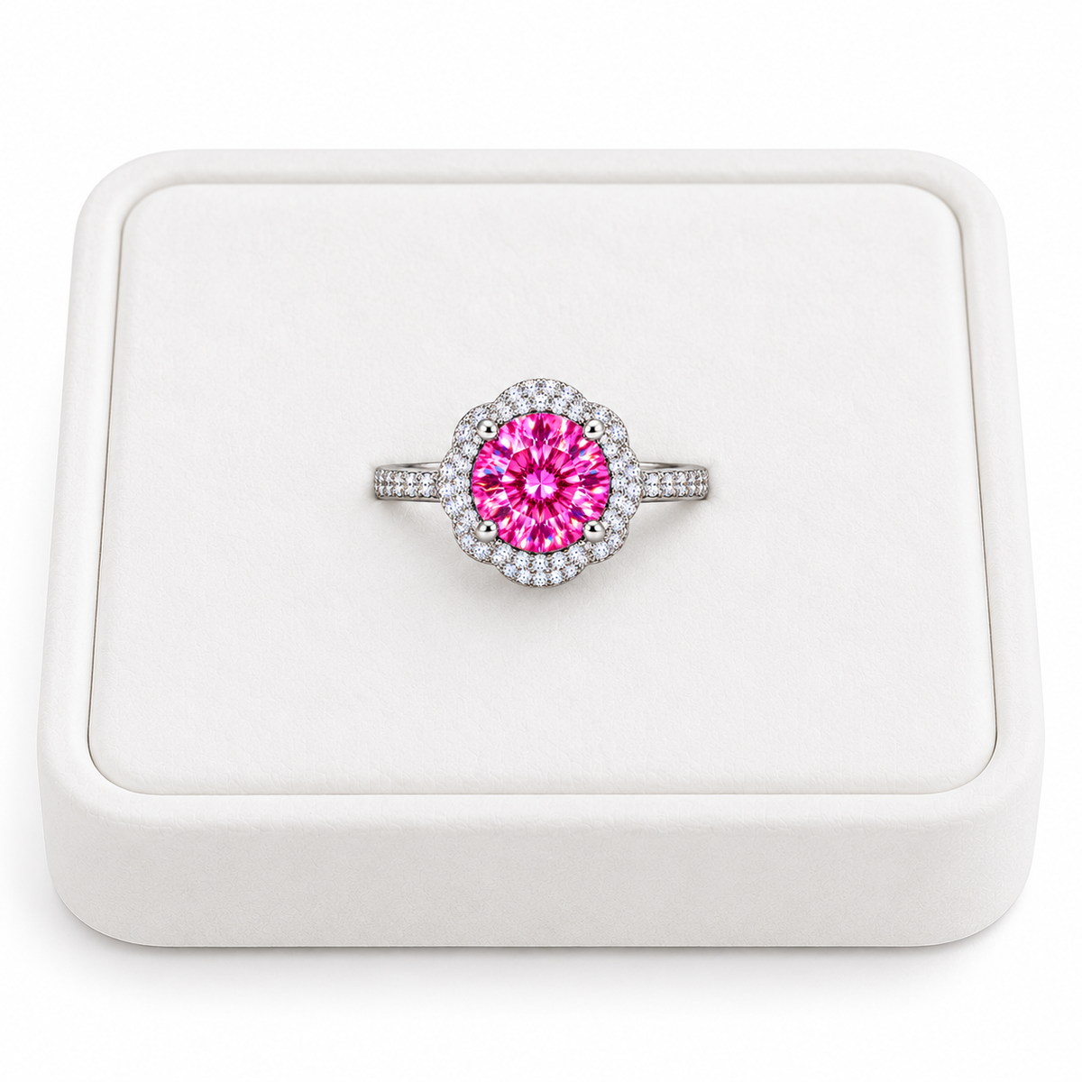 Phimsera 2 carat brilliant pink moissanite floral halo ring displayed on a premium white velvet jewelry tray against a pure white background, featuring a vibrant fuchsia center gemstone and sparkling cubic zirconia accents.