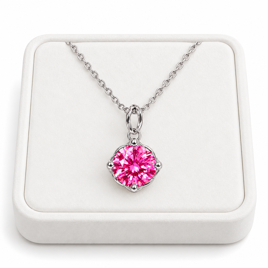 2 carat pink moissanite solitaire necklace displayed on a premium white velvet jewelry tray with a delicate sterling silver chain and brilliant 8mm round fuchsia-pink gemstone in a four-prong setting.