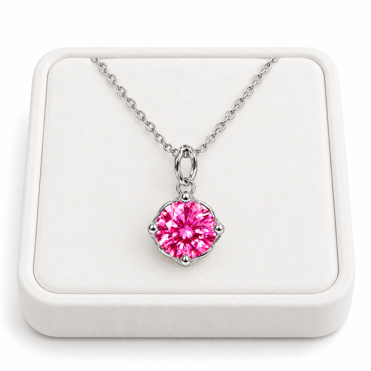 2 carat pink moissanite solitaire necklace displayed on a premium white velvet jewelry tray with a delicate sterling silver chain and brilliant 8mm round fuchsia-pink gemstone in a four-prong setting.