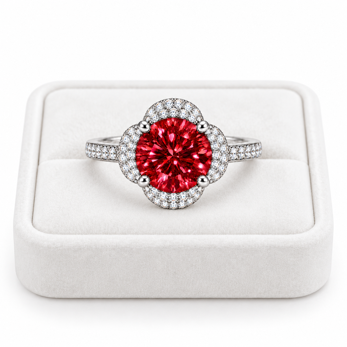 Phimsera 2 carat brilliant red moissanite floral halo ring displayed on a premium white velvet jewelry tray against a pure white background, featuring a vibrant crimson center gemstone and sparkling cubic zirconia accents.