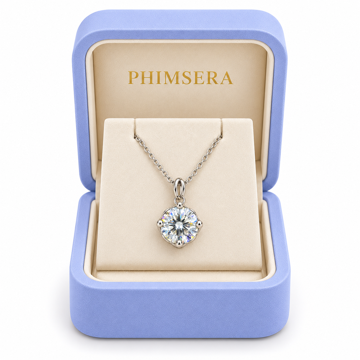 2 carat white moissanite solitaire necklace displayed inside an open periwinkle Phimsera jewelry gift box with an ivory interior, gold Phimsera logo, and white background.