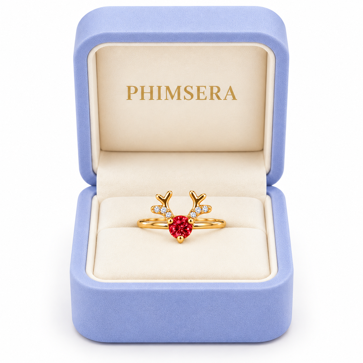 Phimsera 4mm red moissanite Christmas reindeer ring displayed inside an open periwinkle jewelry gift box with an ivory interior and gold Phimsera branding against a white background.