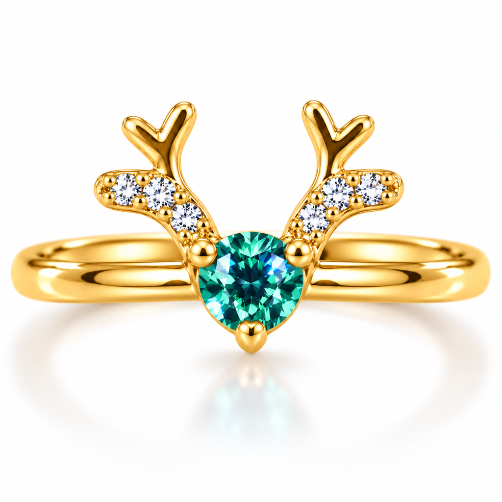 Front view of Phimsera Christmas reindeer ring featuring a 4mm heart-cut teal-green moissanite gemstone, sparkling white CZ antlers and polished gold-plated 925 sterling silver band on a pure white background.