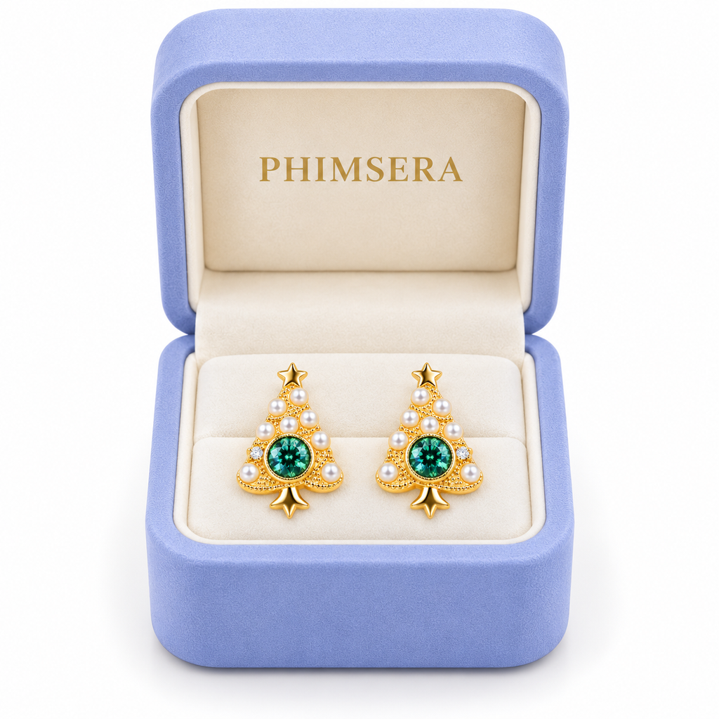 Green moissanite Christmas tree stud earrings displayed in an open periwinkle Phimsera gift box with ivory interior.