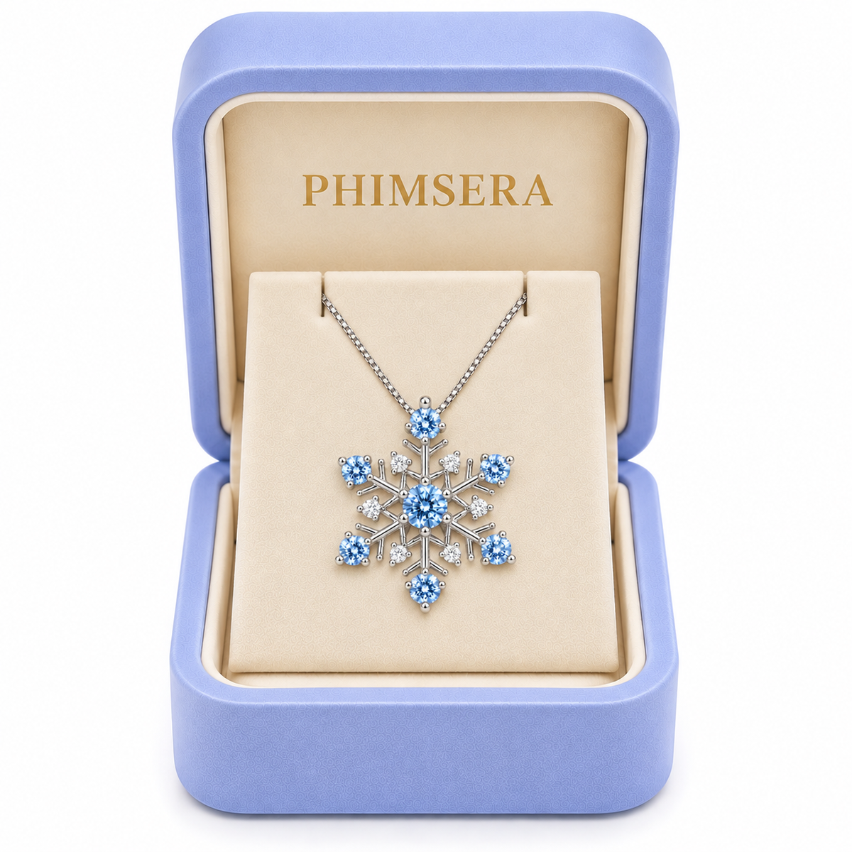 Icy blue moissanite snowflake necklace displayed inside a periwinkle Phimsera jewelry gift box with ivory velvet interior and gold PHIMSERA lettering, featuring seven sparkling blue moissanite gemstones and white cubic zirconia accents.