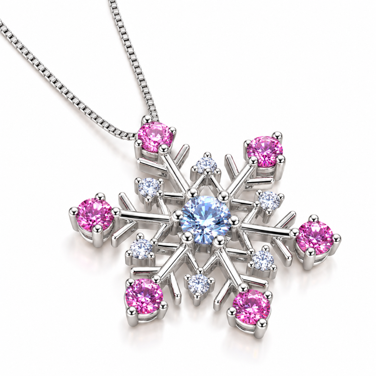 Angled view of an icy blue and pink moissanite snowflake pendant necklace showcasing the six-point sterling silver snowflake design, brilliant blue center gemstone, sparkling pink moissanite tips and delicate silver chain.