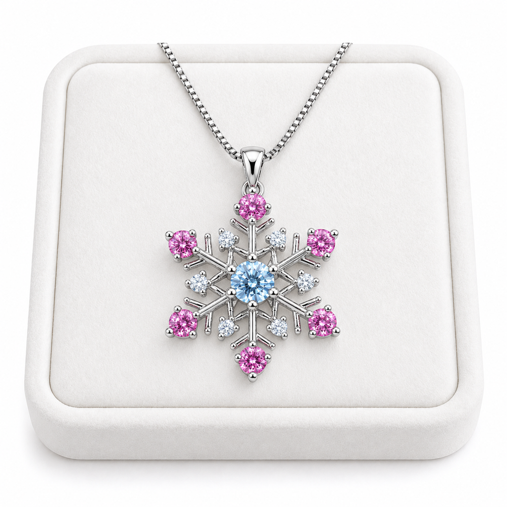 Phimsera icy blue and pink moissanite snowflake necklace displayed on a premium white velvet jewelry tray against a pure white background, featuring a brilliant blue center stone, six pink moissanite gemstones and sparkling silver snowflake design.