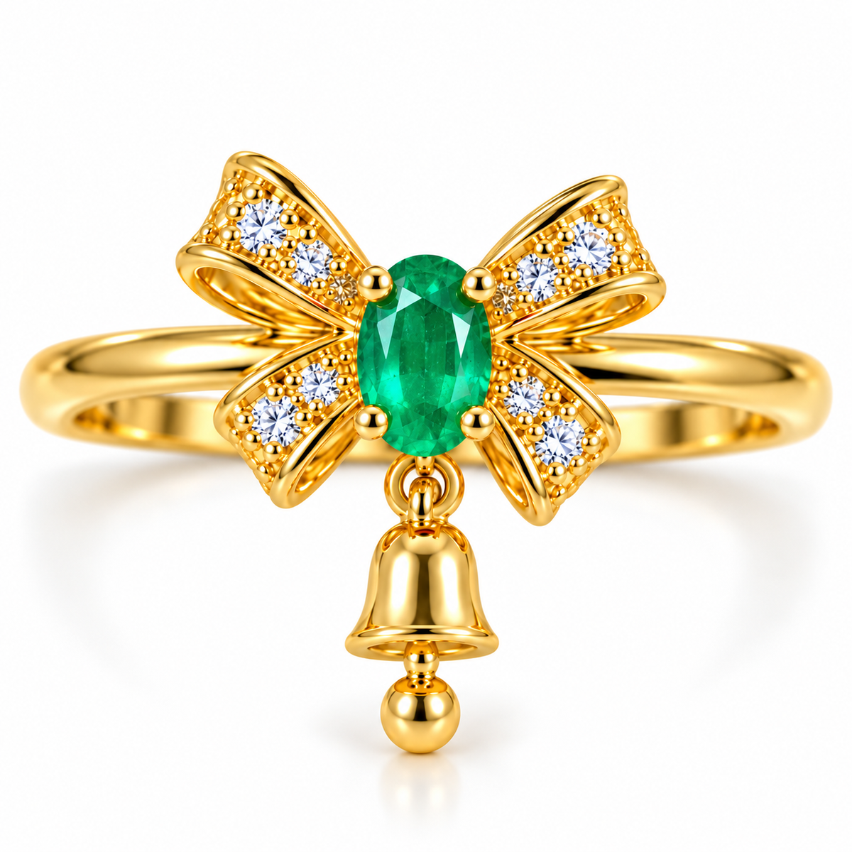 Front view of Phimsera natural emerald Christmas bow ring featuring a 3x4mm oval vivid green emerald, sparkling white CZ ribbon bow and dangling gold bell charm in gold-plated 925 sterling silver.