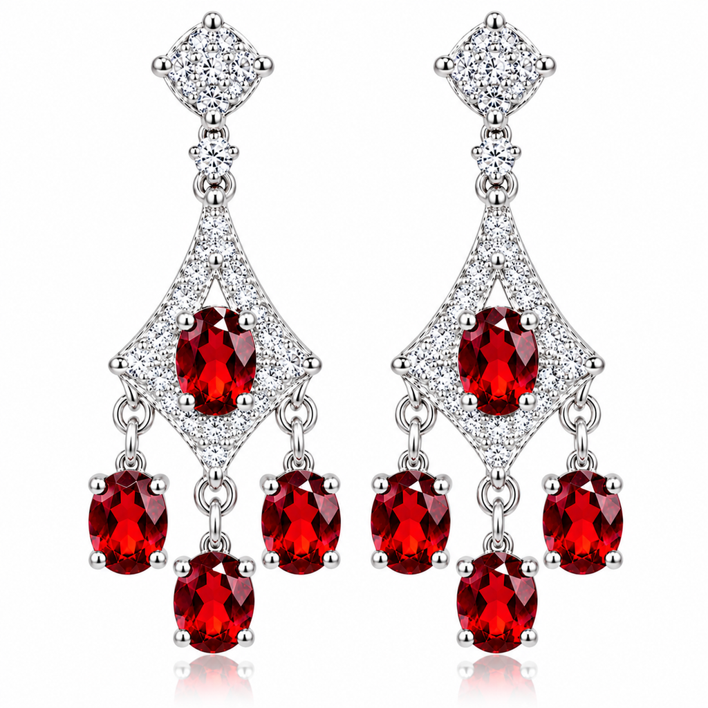 Front-facing photograph of matching natural red garnet chandelier dangle earrings featuring oval 4x5mm crimson gemstones, sparkling cubic zirconia geometric frames, and three cascading garnet drops beneath each earring on a pure white background.