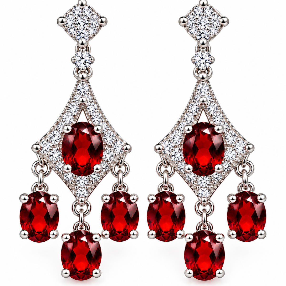 A pair of silver-tone dangle earrings featuring oval-cut deep red center stones and three cascading oval red drops, accented with clear pavé stones, set against a plain white background.