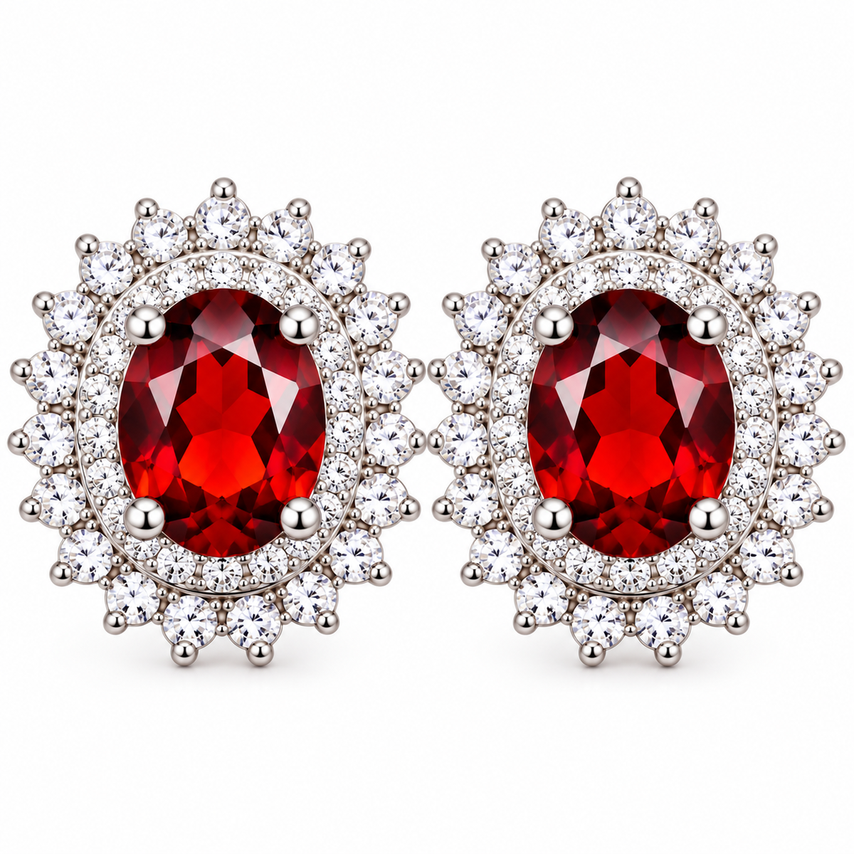 Natural red garnet double halo stud earrings featuring two 5x7mm oval crimson-red gemstones surrounded by sparkling clear cubic zirconia in polished 925 sterling silver four-prong settings against a pure white background.
