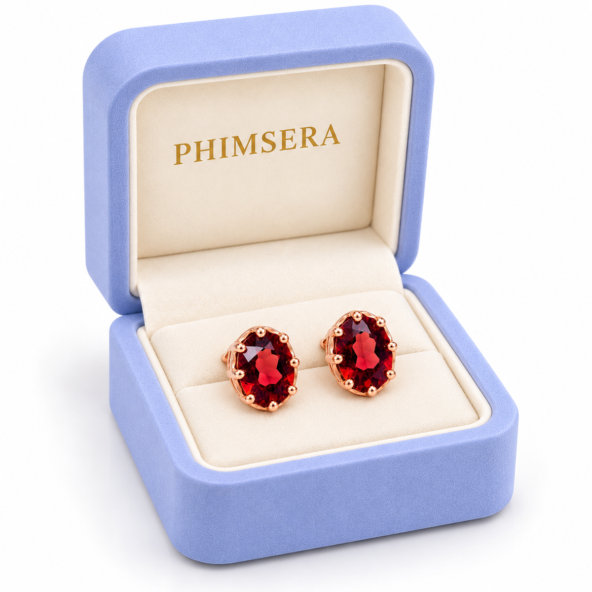 Angled view of a periwinkle Phimsera jewelry gift box containing natural 6x8mm red garnet oval stud earrings in rose gold plated sterling silver, with a soft ivory jewelry insert and gold Phimsera branding.