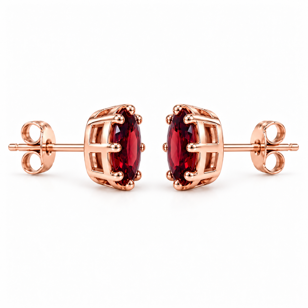 Side profile of natural 6x8mm red garnet stud earrings showing oval gemstone depth, polished rose gold plated sterling silver open-gallery settings, rounded prongs, straight posts, and butterfly backs.
