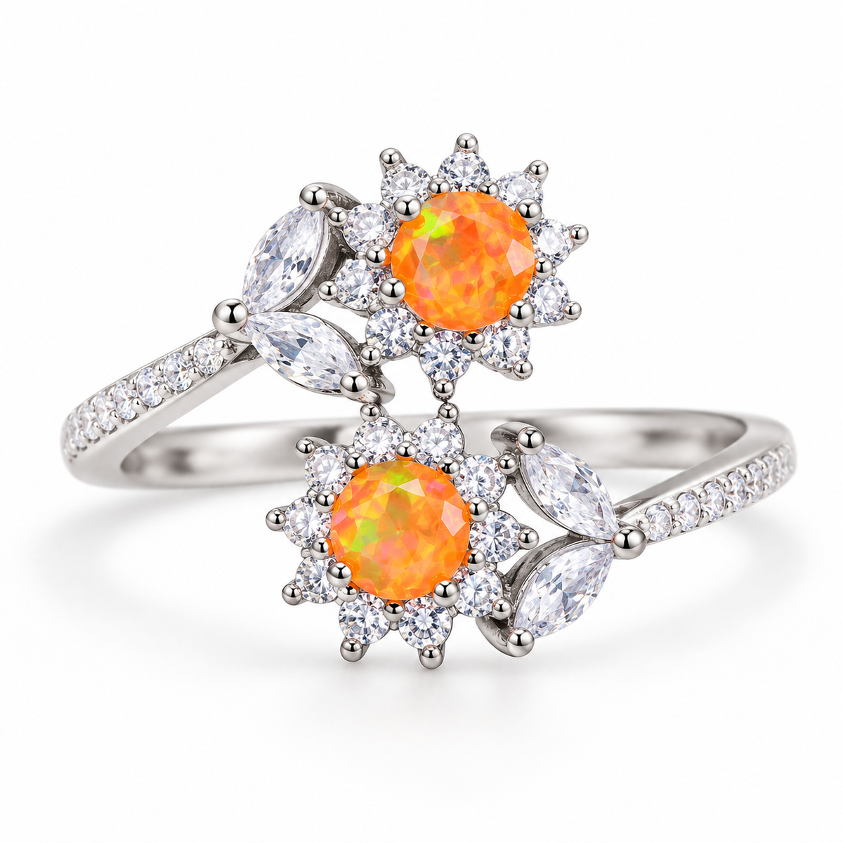 Orange fire opal bypass ring with two 4mm orange-dyed Australian opals, floral cubic zirconia accents, and a silver-tone band on a white background.