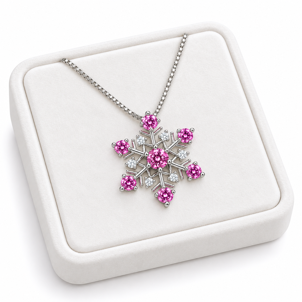 Angled white velvet tray presentation of a pink moissanite snowflake necklace featuring seven vibrant pink gemstones, six sparkling white cubic zirconia accents and a silver chain.