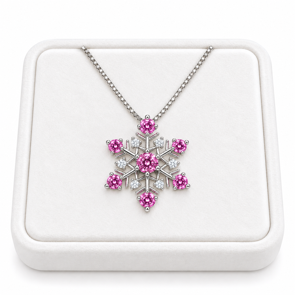Pink moissanite snowflake pendant necklace displayed on a premium white velvet jewelry tray against a pure white background, showing the delicate silver chain and pink and white gemstones.