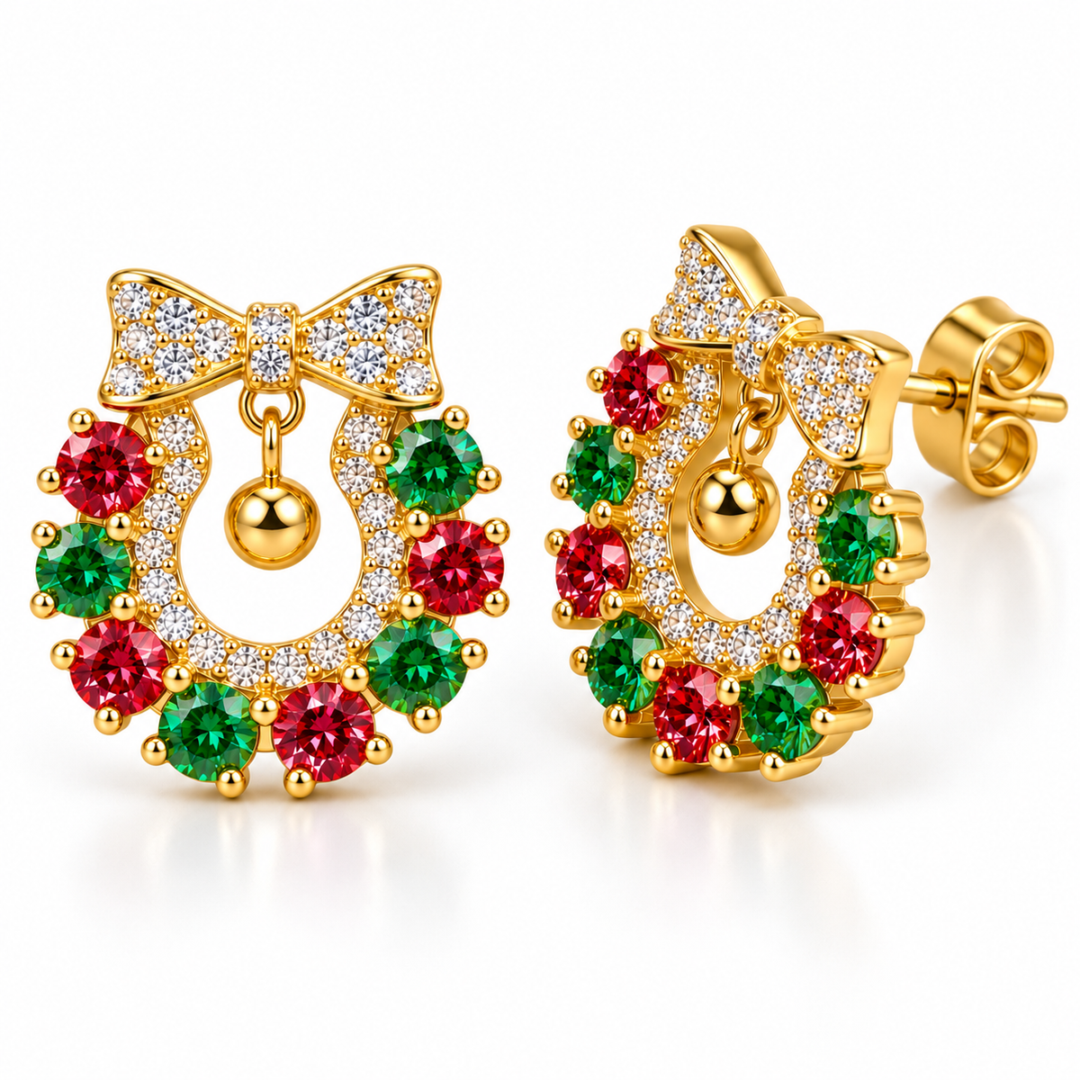 Macro photograph of red and green moissanite Christmas wreath earrings highlighting brilliant round-cut gemstones, white CZ pavé accents, polished gold bows and dangling gold ball ornaments.