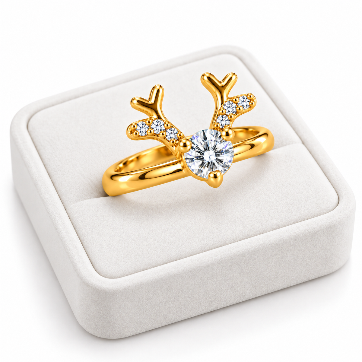 Angled white velvet jewelry tray displaying a gold-plated sterling silver reindeer ring with brilliant white moissanite and sparkling cubic zirconia antlers.
