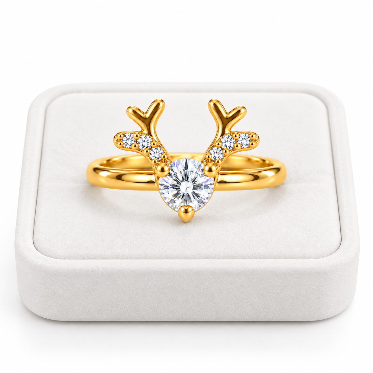 Gold Christmas reindeer antler ring featuring a 4mm round white moissanite gemstone displayed on a premium white velvet jewelry tray against a pure white background.