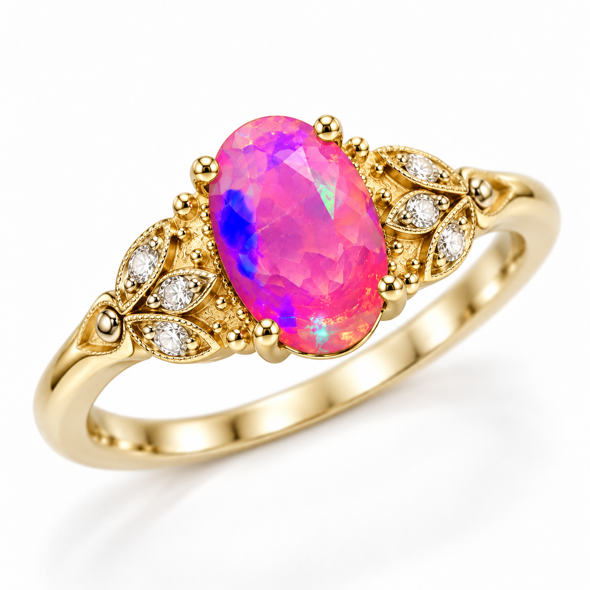 Angled view of a 5x8mm pink fire opal ring featuring an oval pink gemstone, decorative gold plated leaf shoulders, and clear cubic zirconia accents.