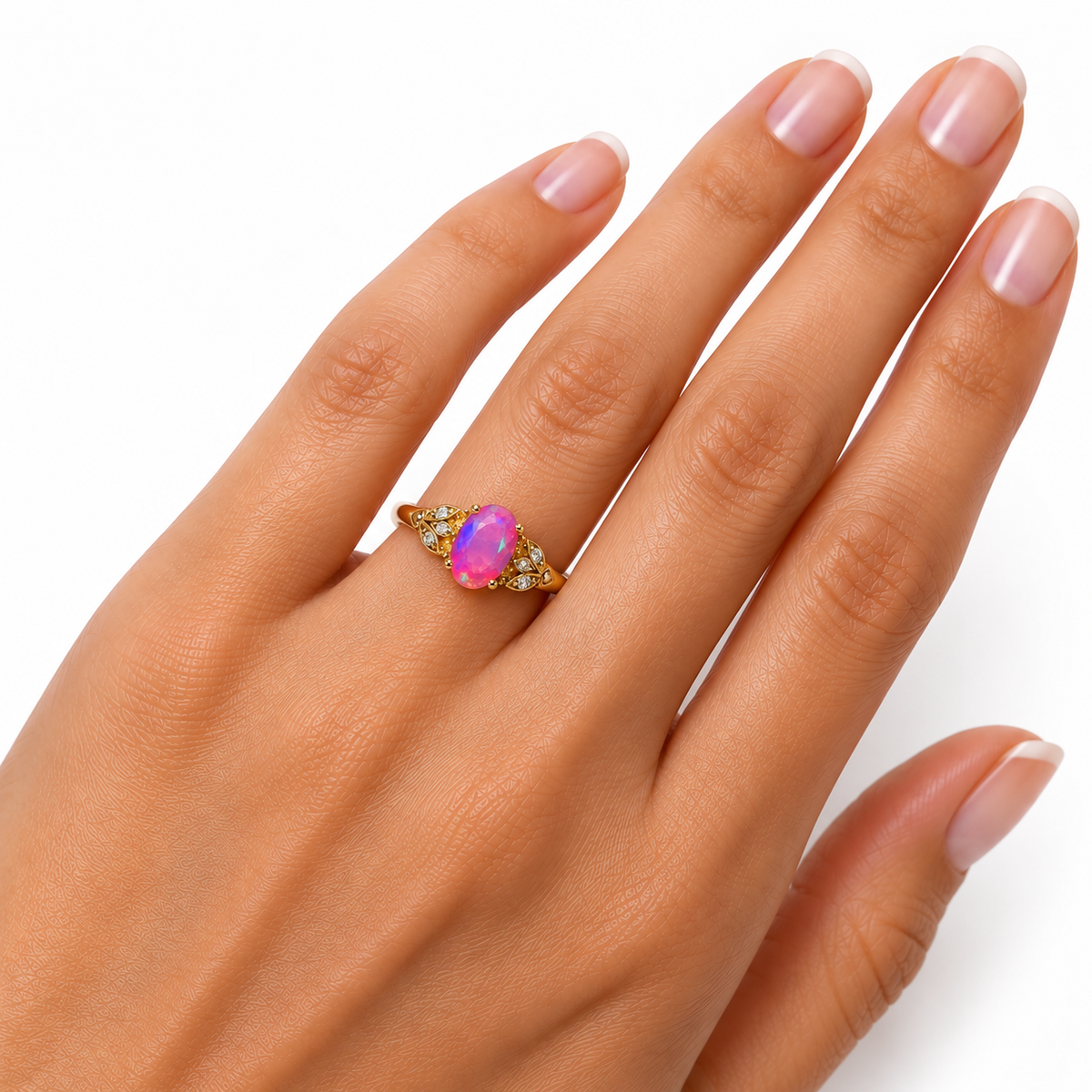 5x8mm oval pink fire opal ring worn on a woman's ring finger, showing its delicate proportions, Gold Plated finish, and vintage floral design.