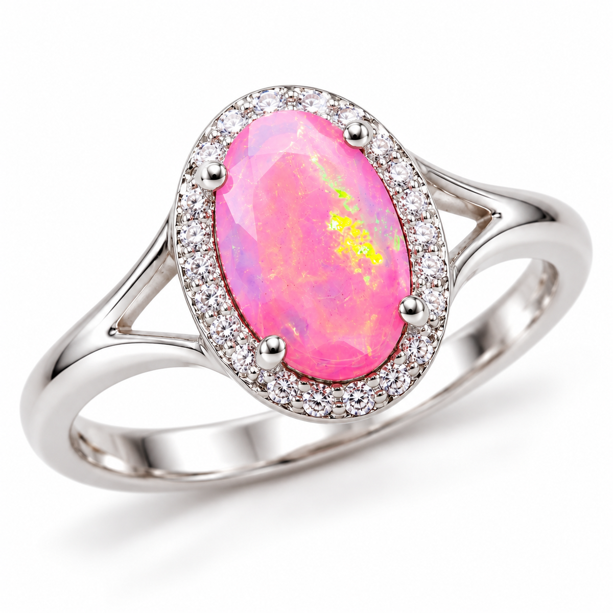 Angled view of a pink fire opal halo ring showing the oval center gemstone, surrounding clear accent stones, and split-shank band.