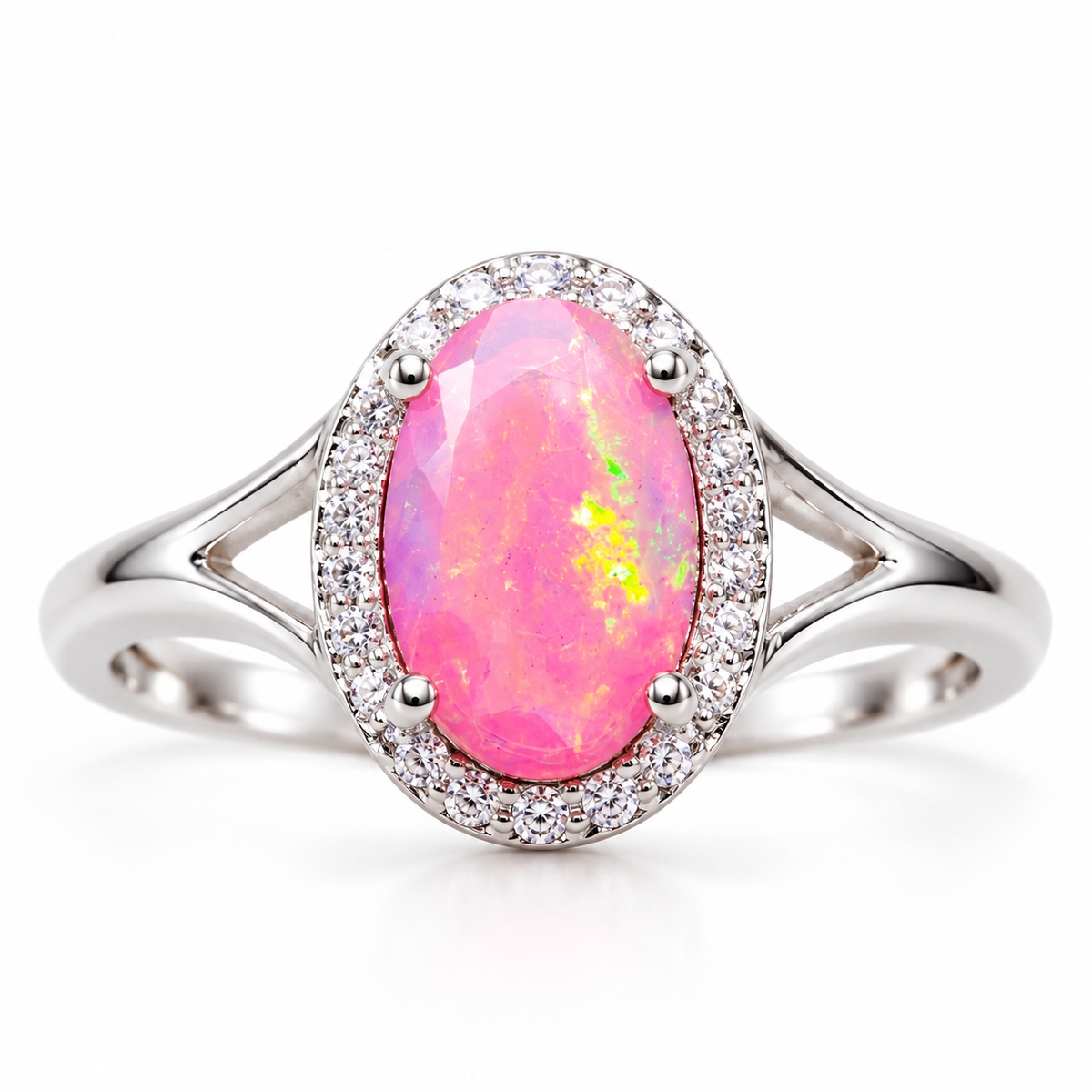 Oval 6x9mm pink fire opal ring with yellow and green flashes, a clear-stone halo, four center prongs, and a split-shank band.